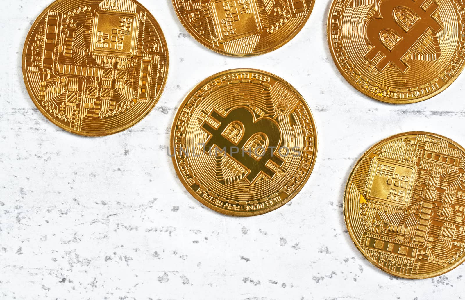 Top down view, golden commemorative btc - bitcoin cryptocurrency - coins scattered on white stone board, closeup detail, empty space down left corner by Ivanko