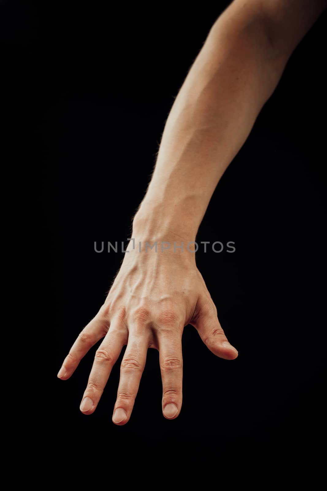 male hand, isolated on black