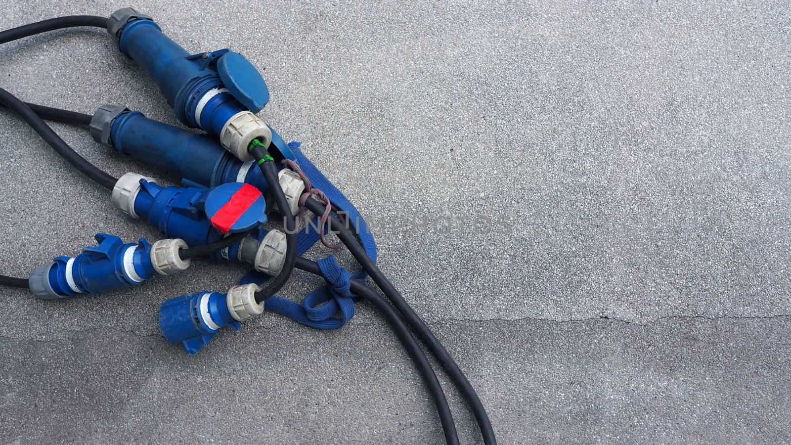 Electric wires line for video production on the concrete floor and top view angle.