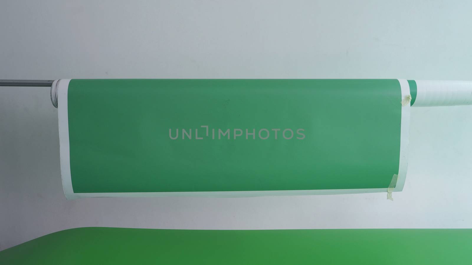 Green screen paper backdrop and tripod. by gnepphoto