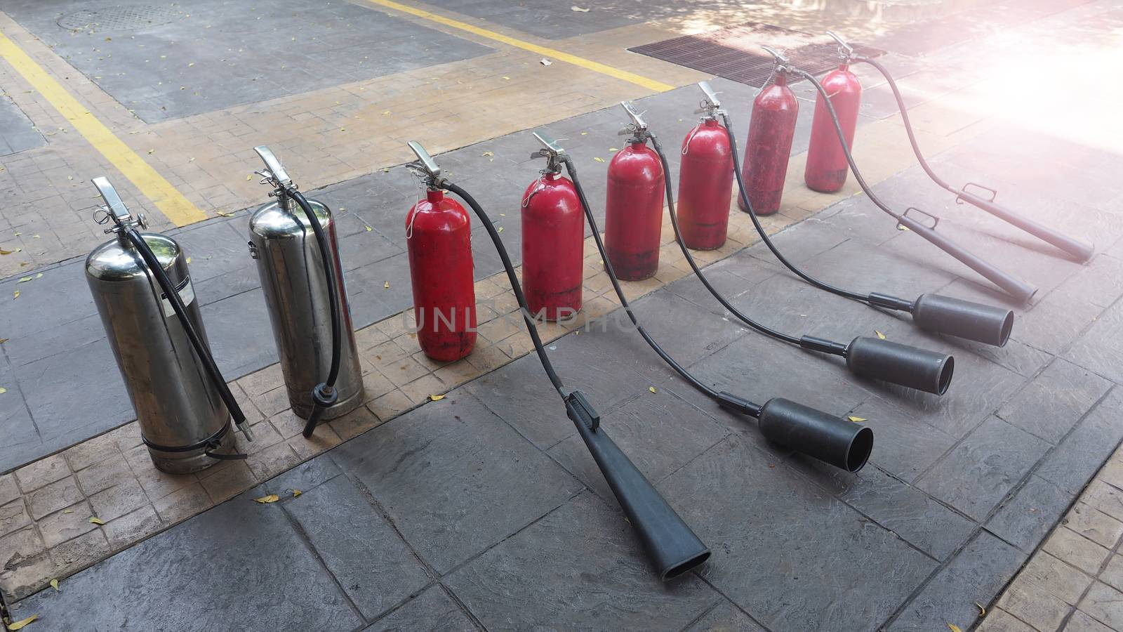 Red and silver color of fire extinguisher tank by gnepphoto