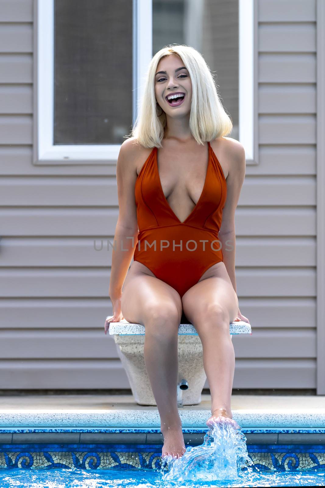 A Young Lovely Blonde Model Poses In A Bikini While Enjoying A Summers Day by actionsports