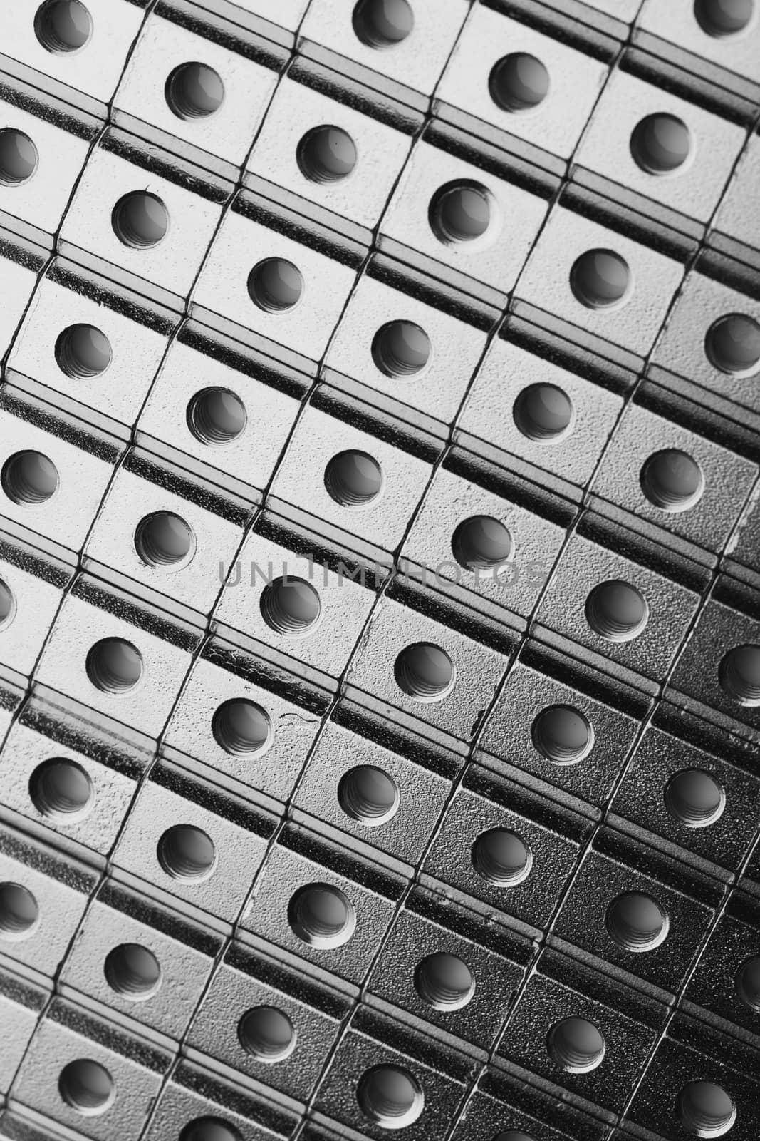 slide screw nuts in a row, abstract industrial background by nikkytok