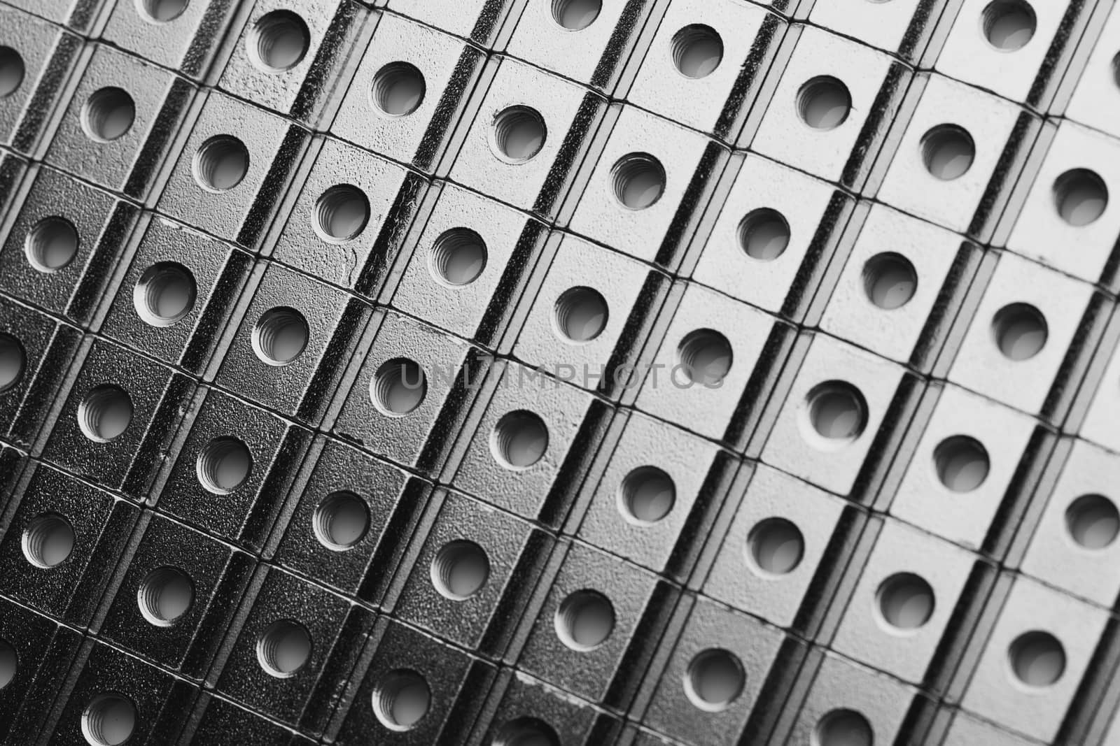 slide screw nuts in a row, abstract industrial background by nikkytok