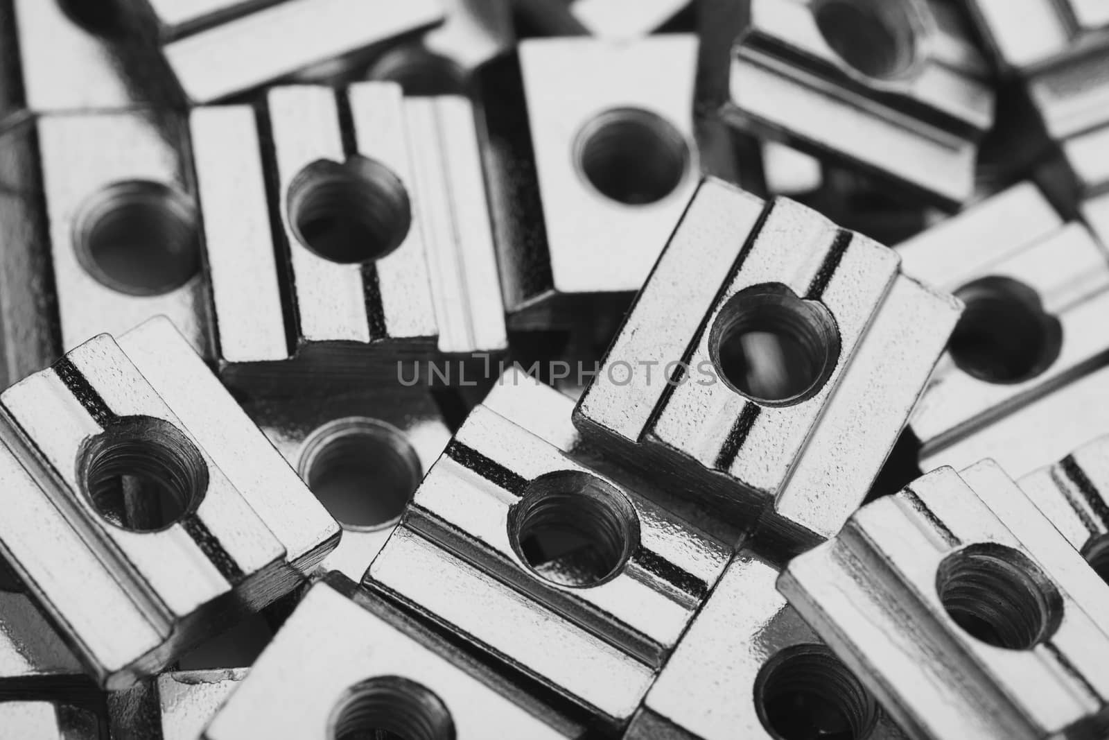 slide screw nuts heap, closeup view by nikkytok