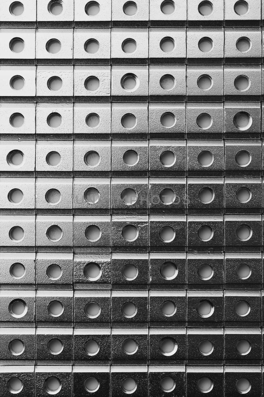 slide screw nuts in a row, abstract industrial background