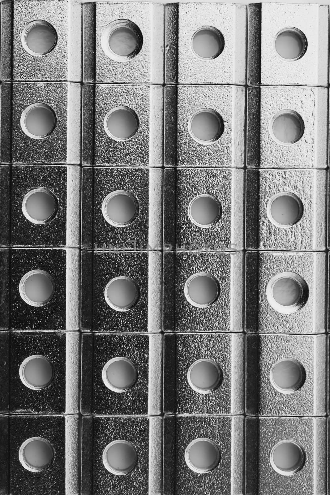 slide screw nuts in a row, abstract industrial background by nikkytok