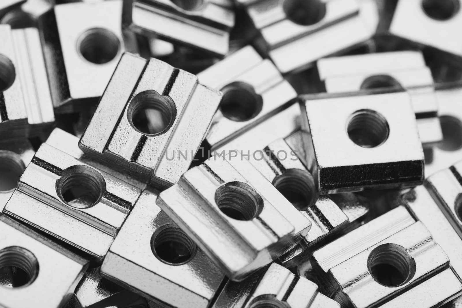 slide screw nuts heap, closeup view by nikkytok