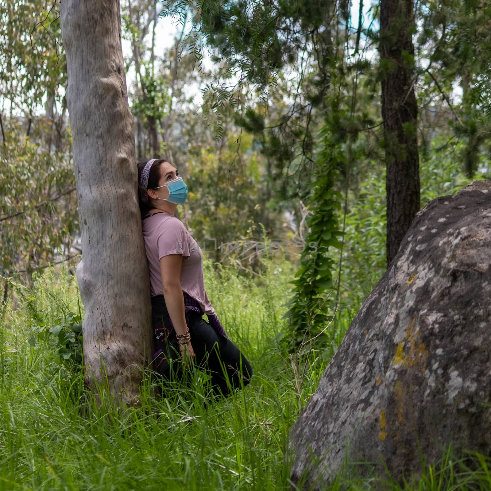 Real woman in the middle of the forest. face mask