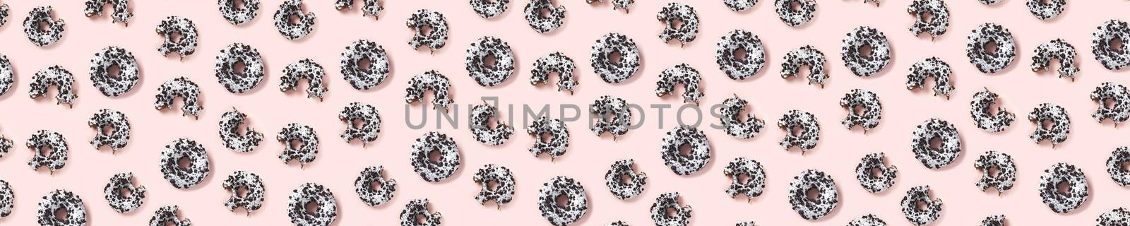 donuts on a pink background top view. Flat lay of delicious nibbled chocolate donuts. used as donut banner or poster background, not pattern. by PhotoTime