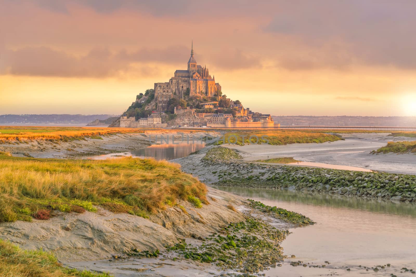 Mont Saint-Michel at sunset twilight in Normandy, northern France