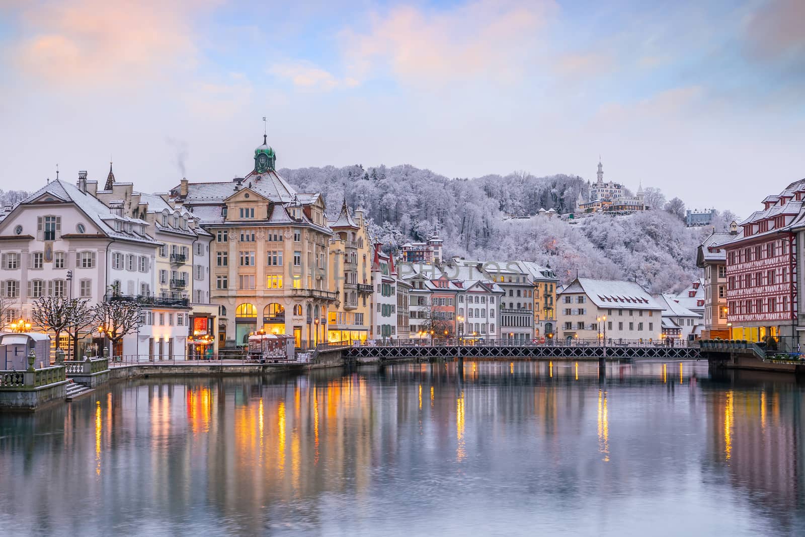 Historic city center of downtown Lucerne with  Chapel Bridge and lake Lucerne in Switzerland at sunset