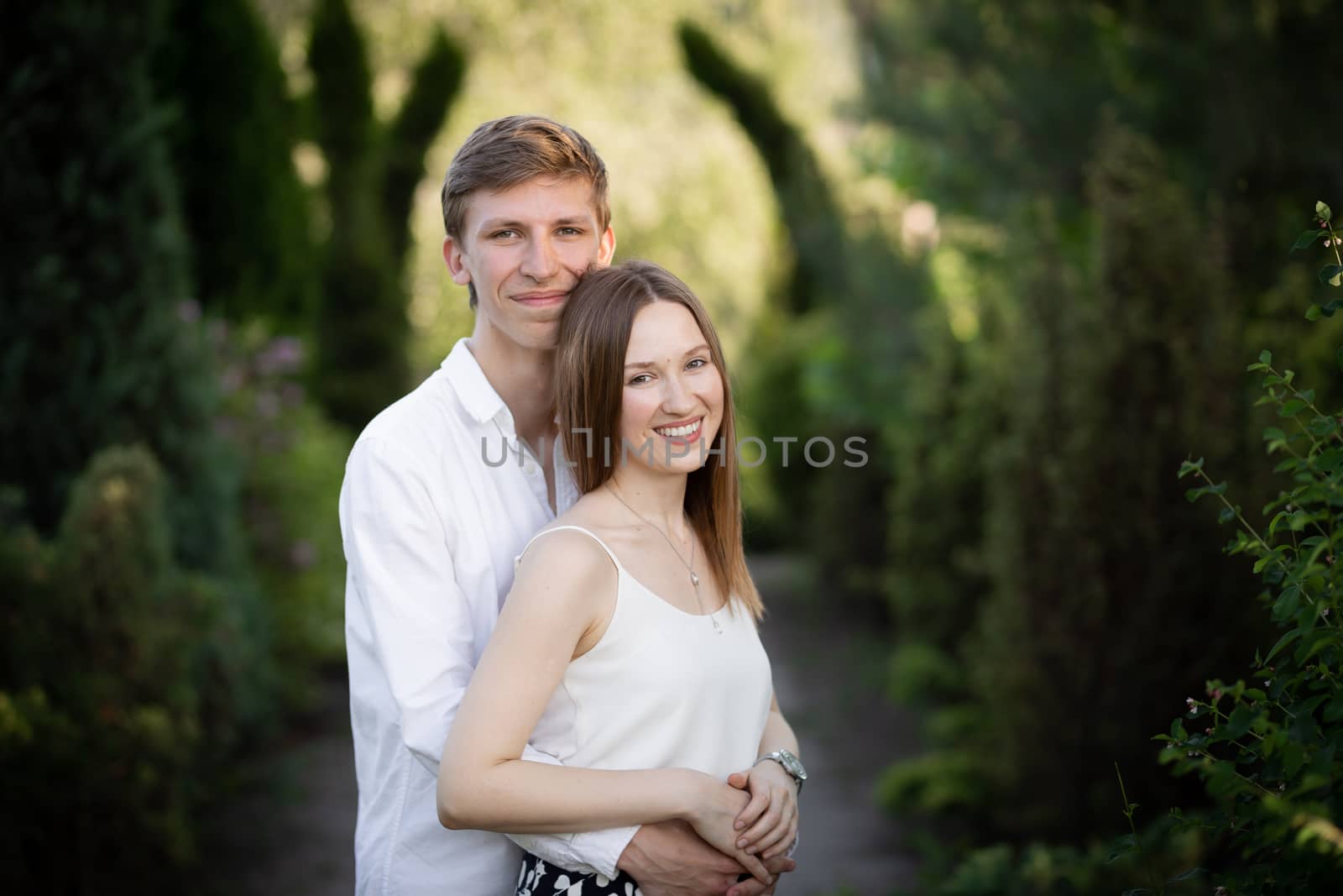 The young couple walking in the park by Boiko