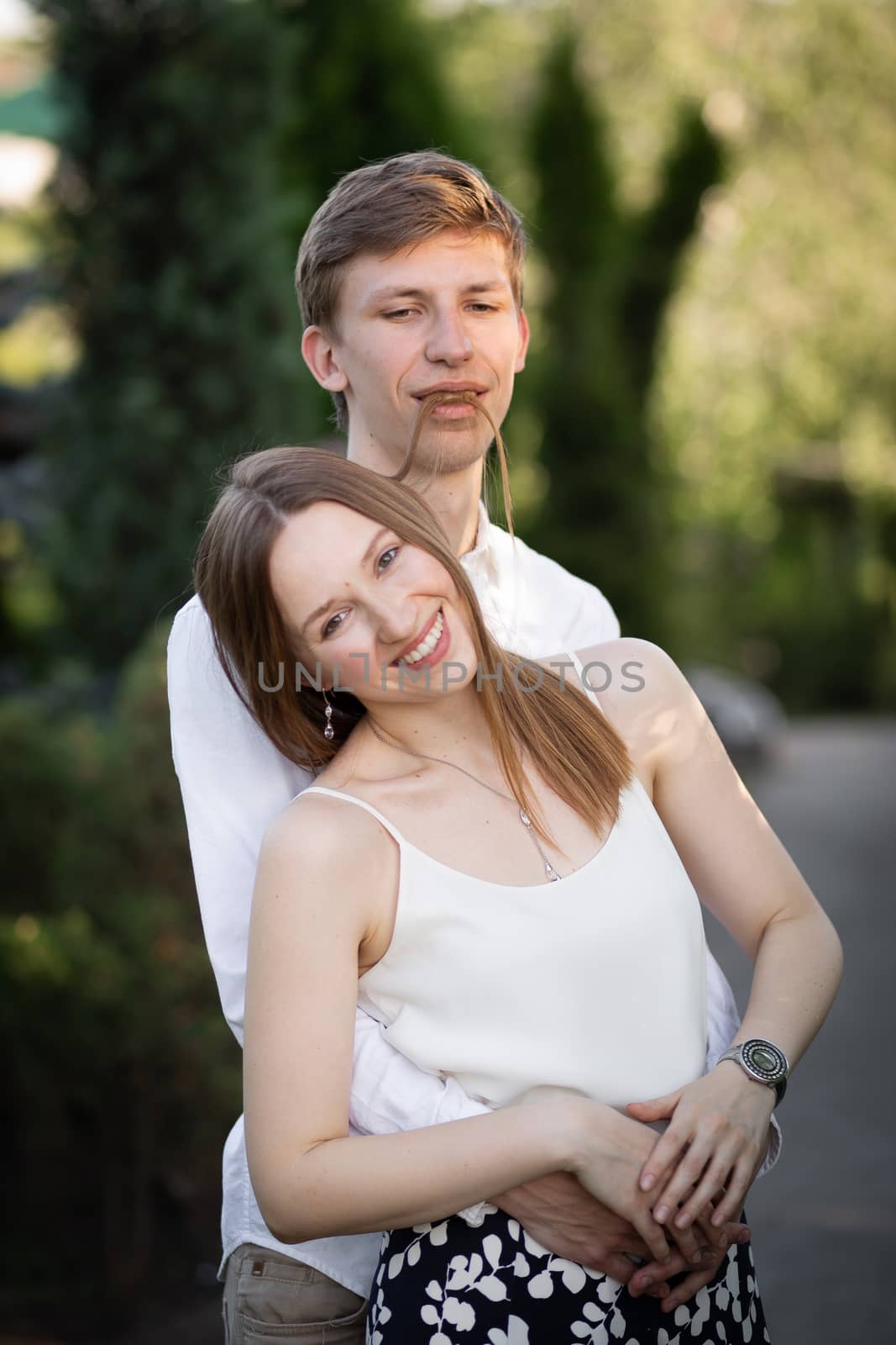 The young couple walking in the park