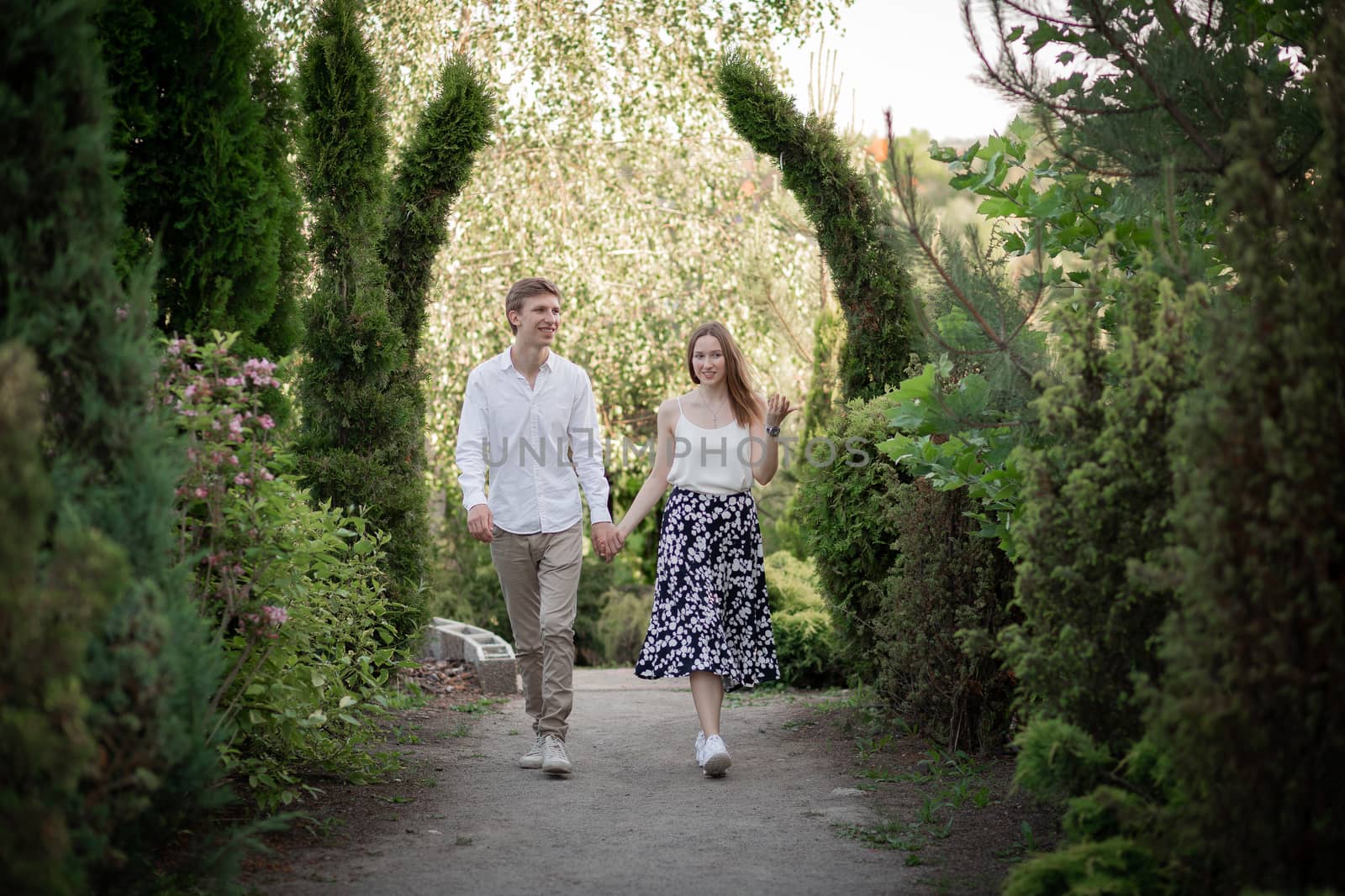 The young couple walking in the park