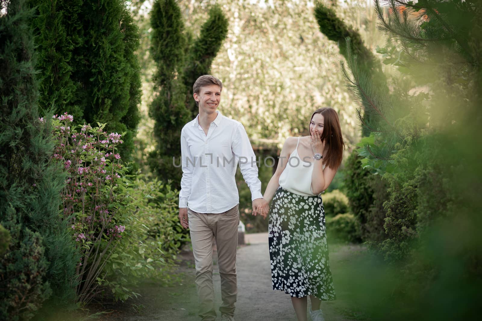 The young couple walking in the park