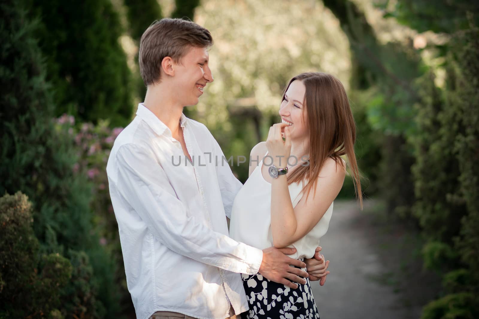 The young couple walking in the park