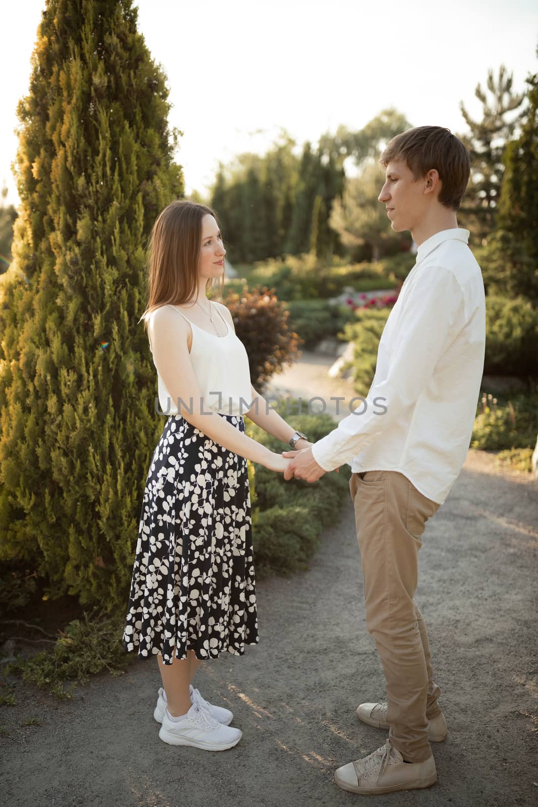 The young couple walking in the park