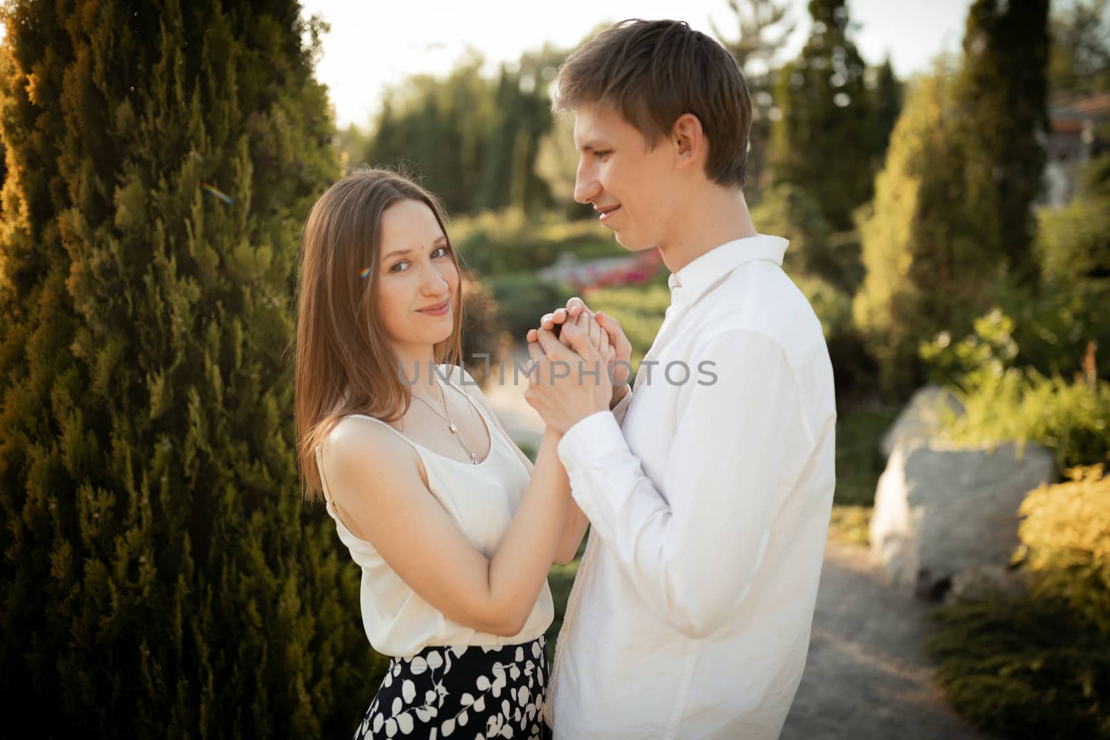 The young couple walking in the park