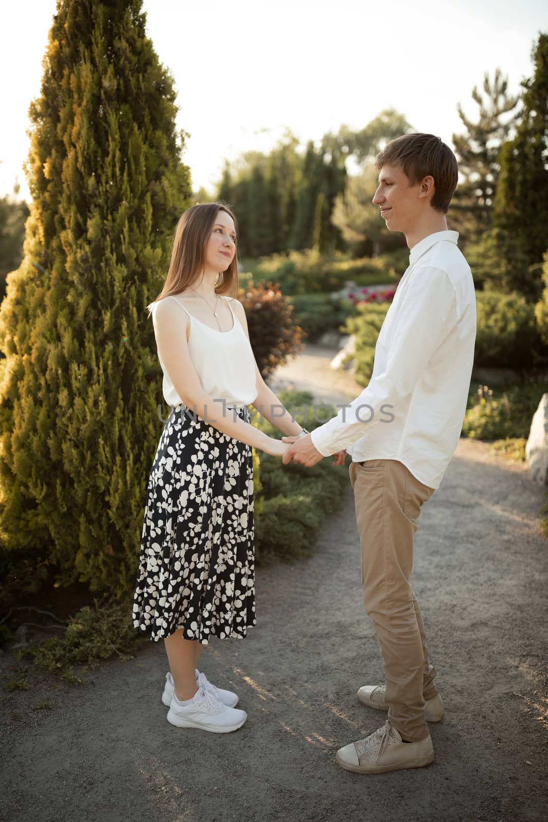 The young couple walking in the park