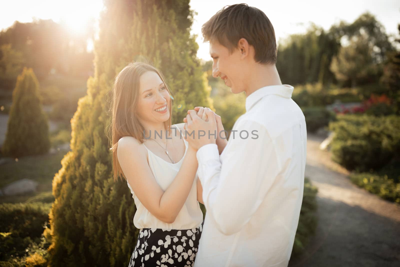 The young couple walking in the park