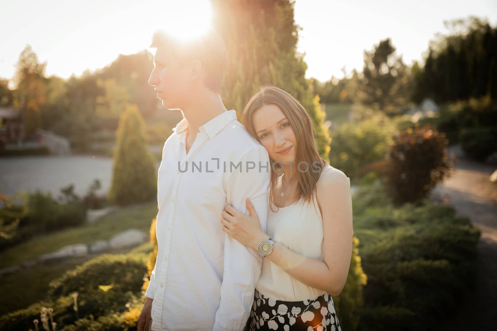 The young couple walking in the park