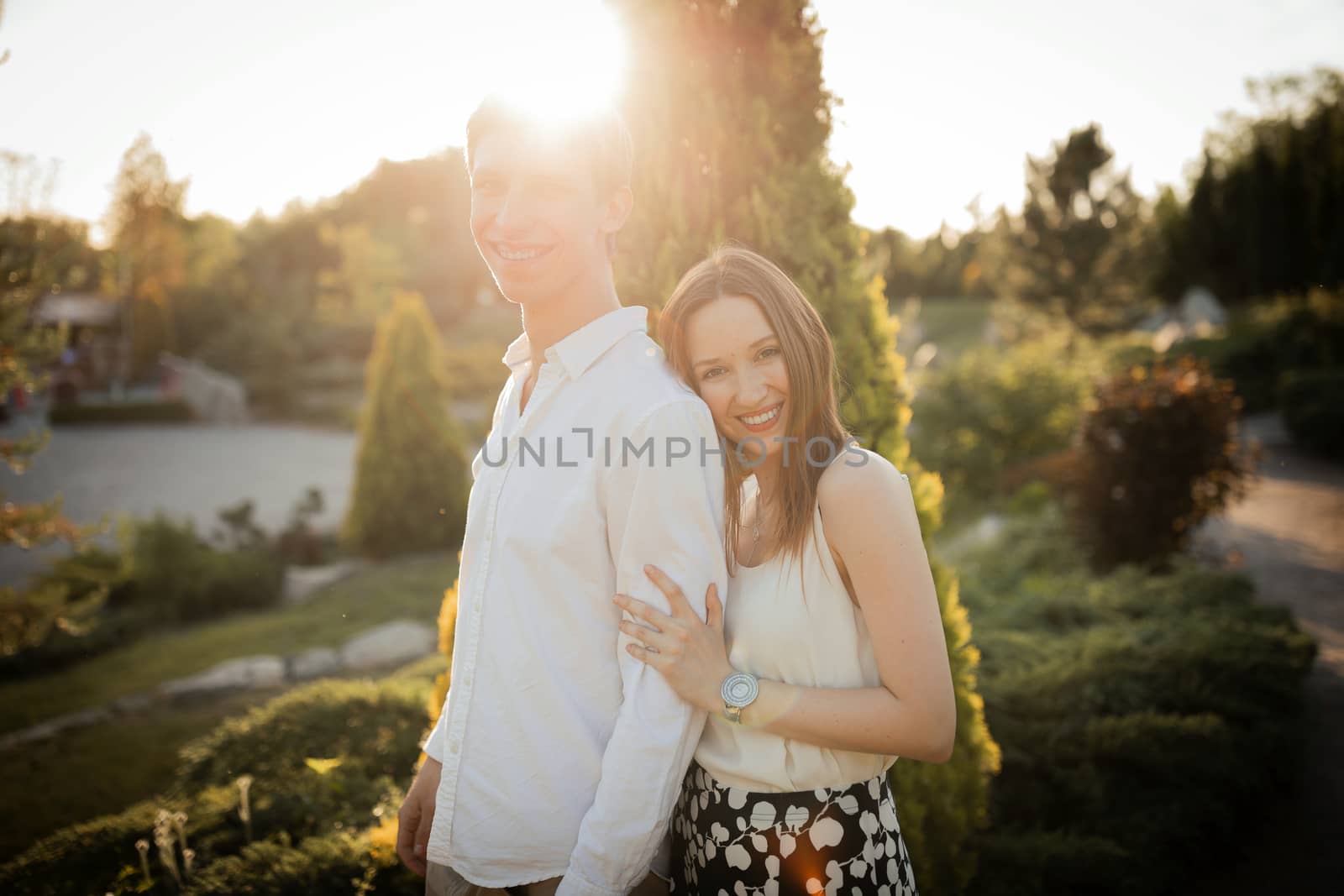 The young couple walking in the park
