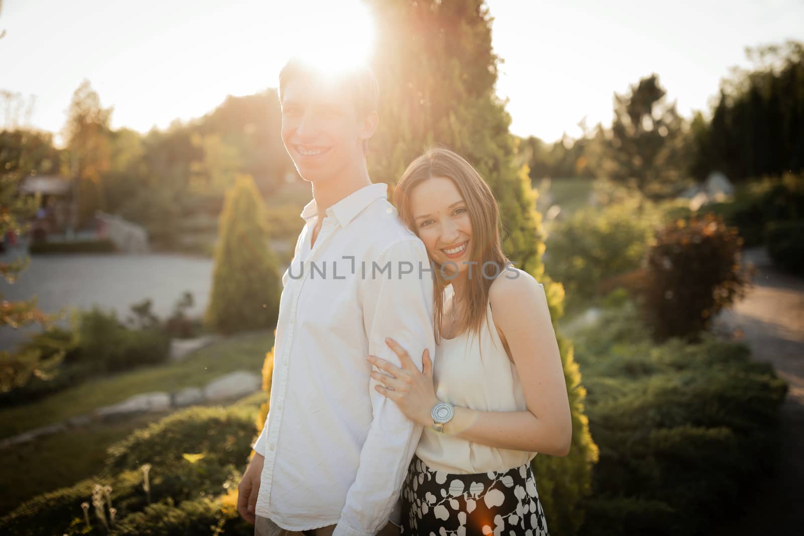 The young couple walking in the park