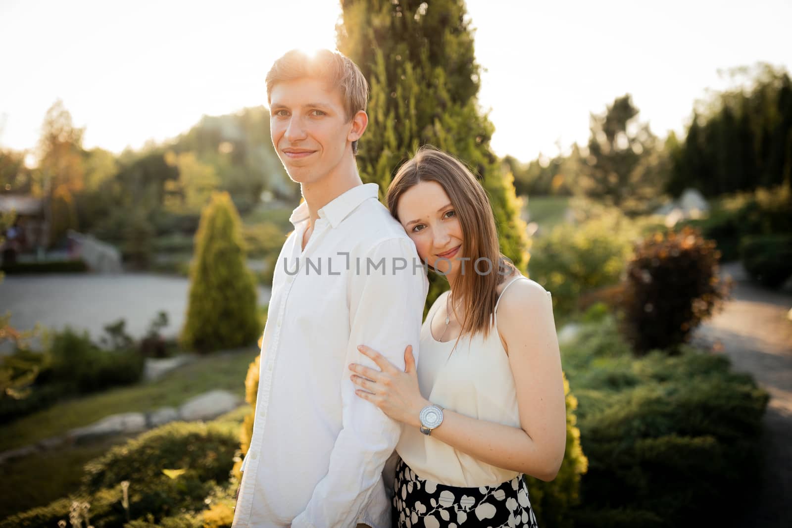 The young couple walking in the park