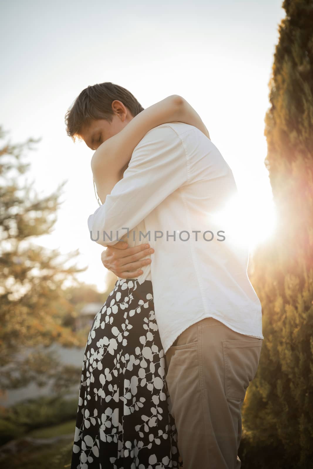 The young couple walking in the park