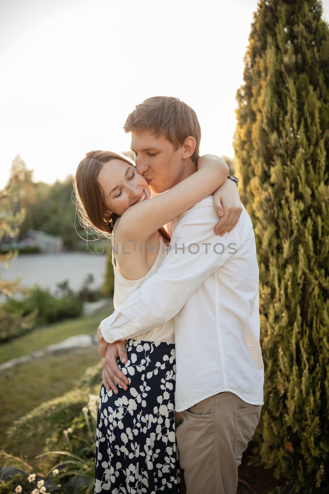 The young couple walking in the park