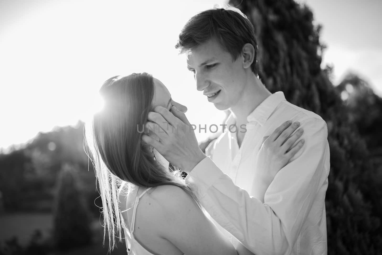 The young couple walking in the park