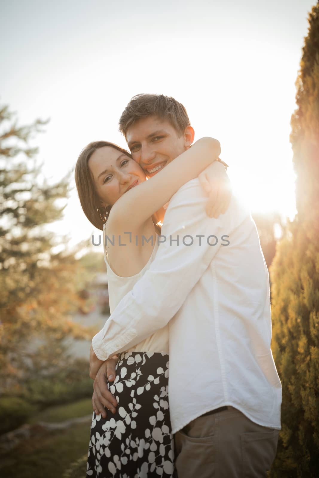 The young couple walking in the park