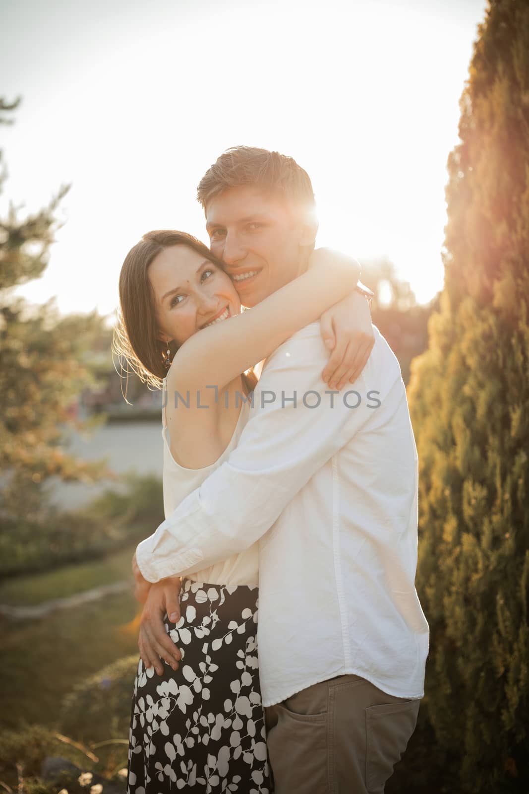 The young couple walking in the park