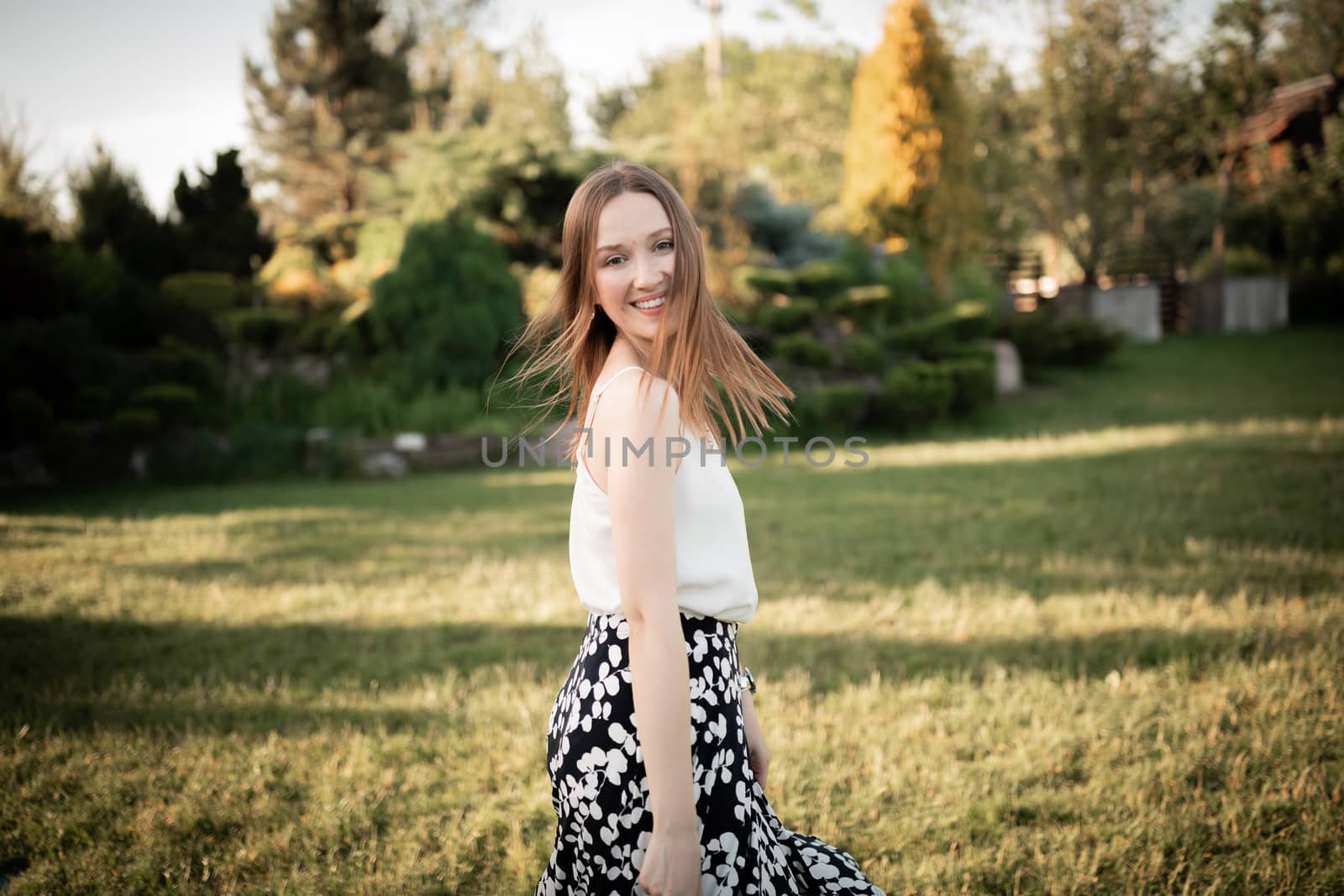 The beautiful young girl in the park