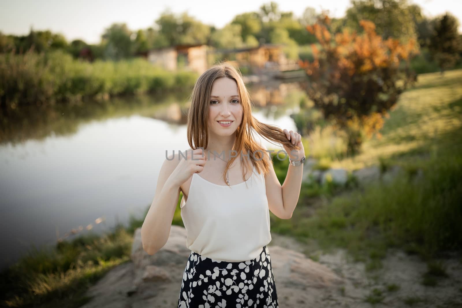 Beautiful girl outside. In the park. On nature