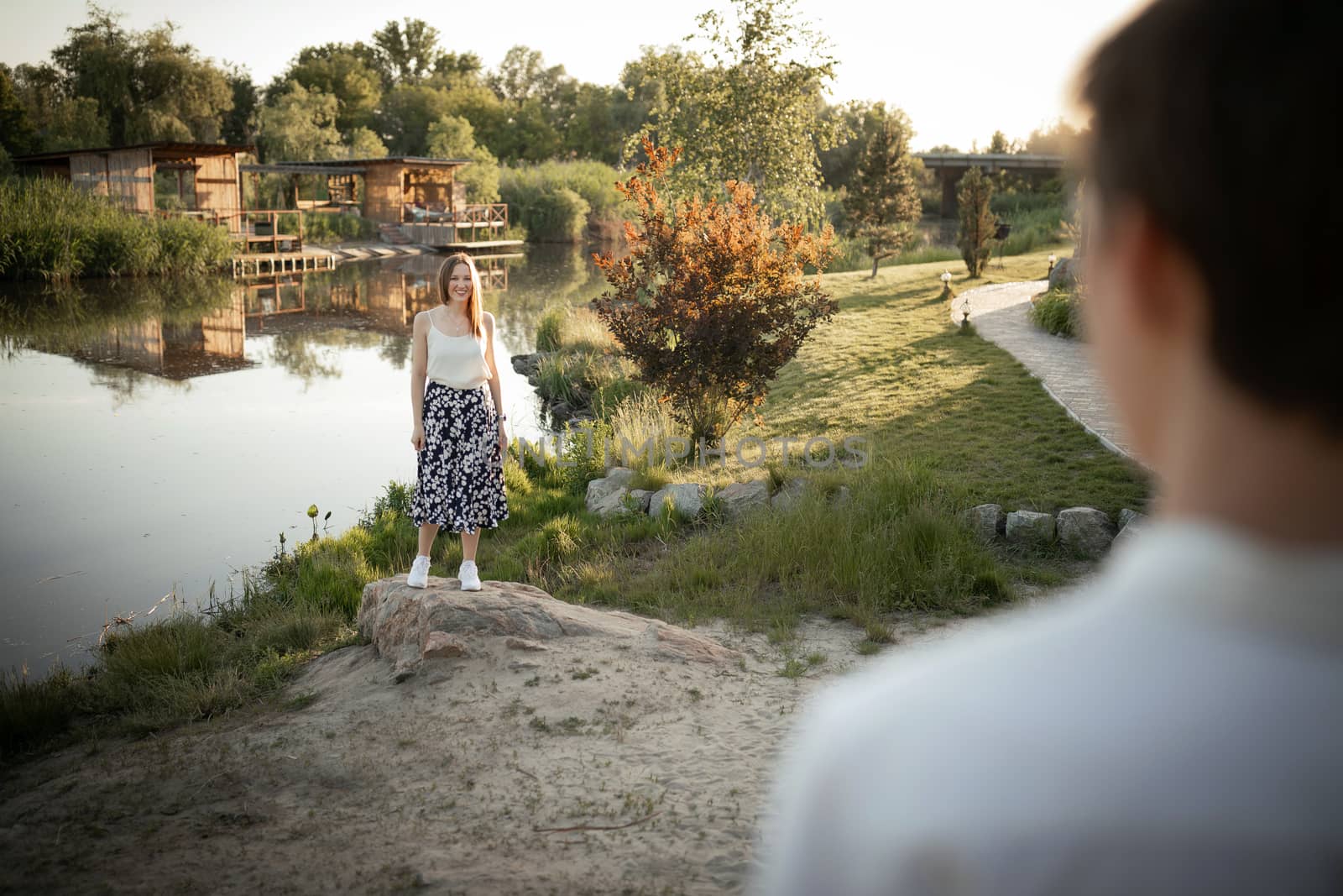 The young couple walking in the park