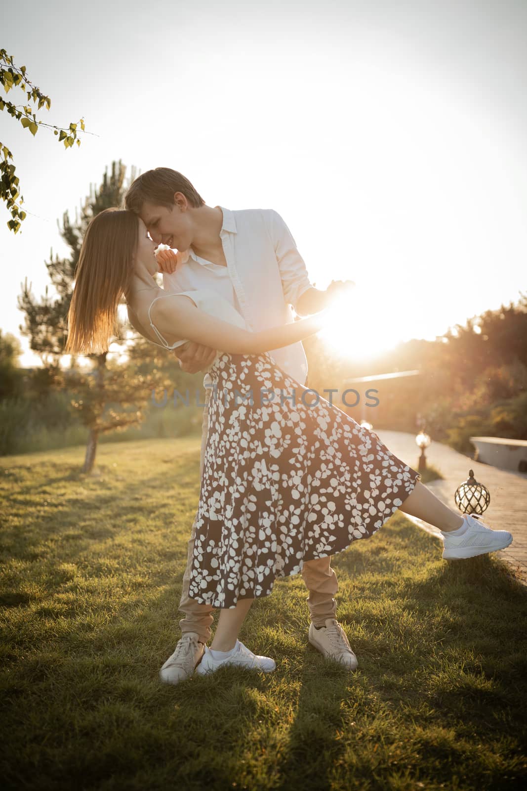 The young couple walking in the park