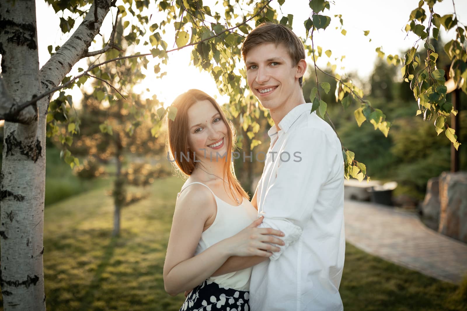 The young couple walking in the park