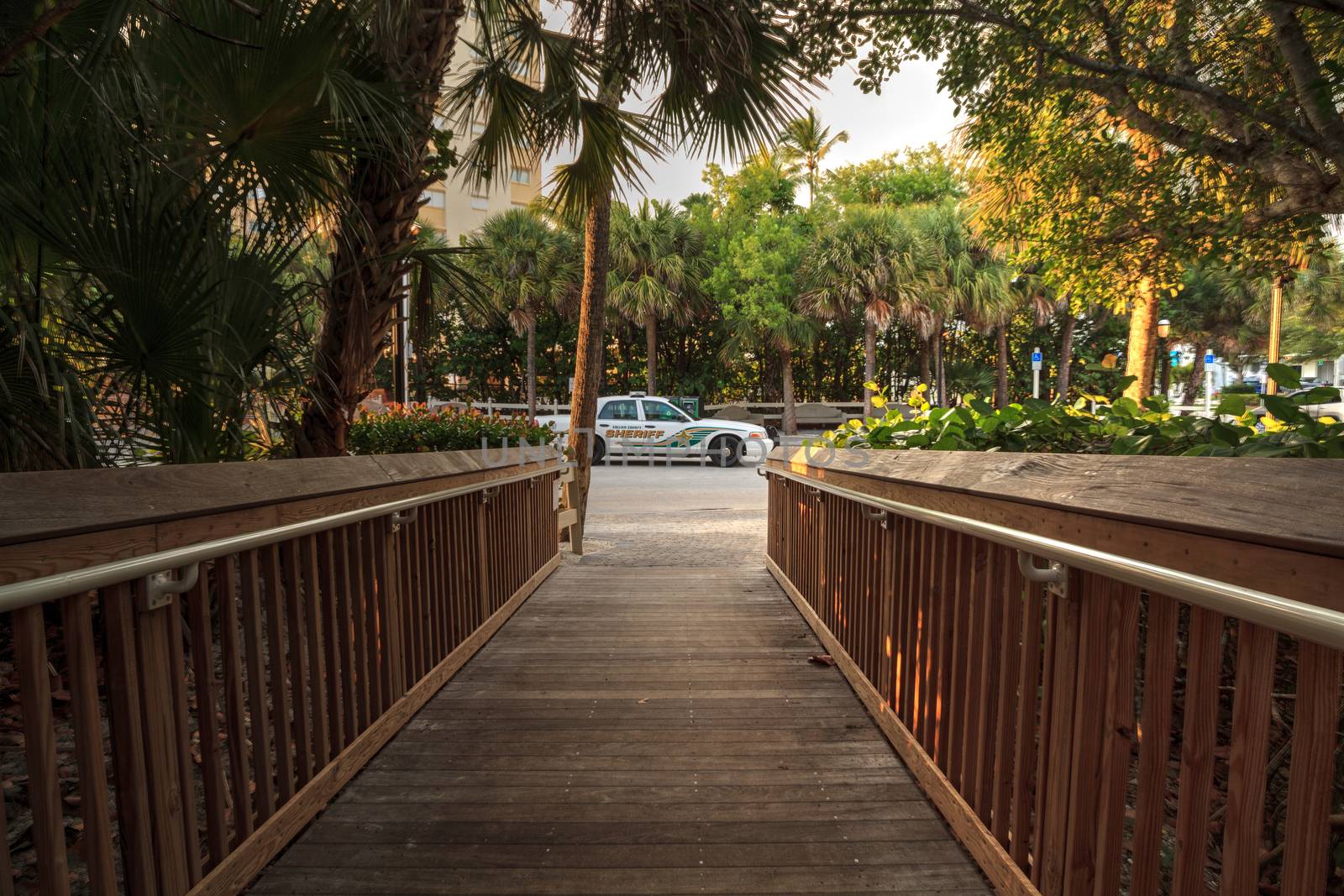 July 26, 2020 – Naples, Florida: Collier County Sheriff car parked in front of the entry of Vanderbilt Beach in Naples, Florida.