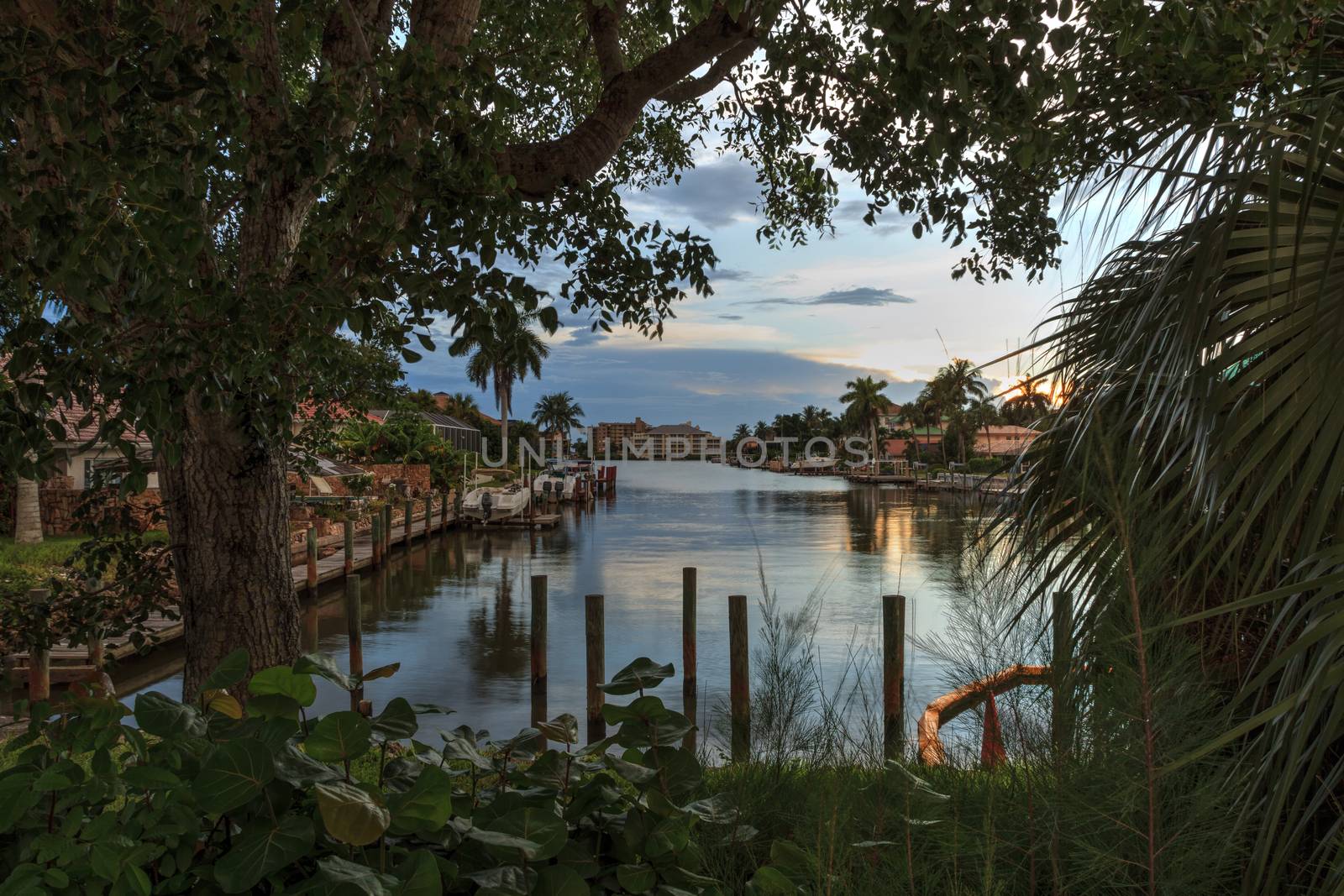 Sunrise over a Waterway leading to the Ocean near Vanderbilt Beach in Naples, Florida.