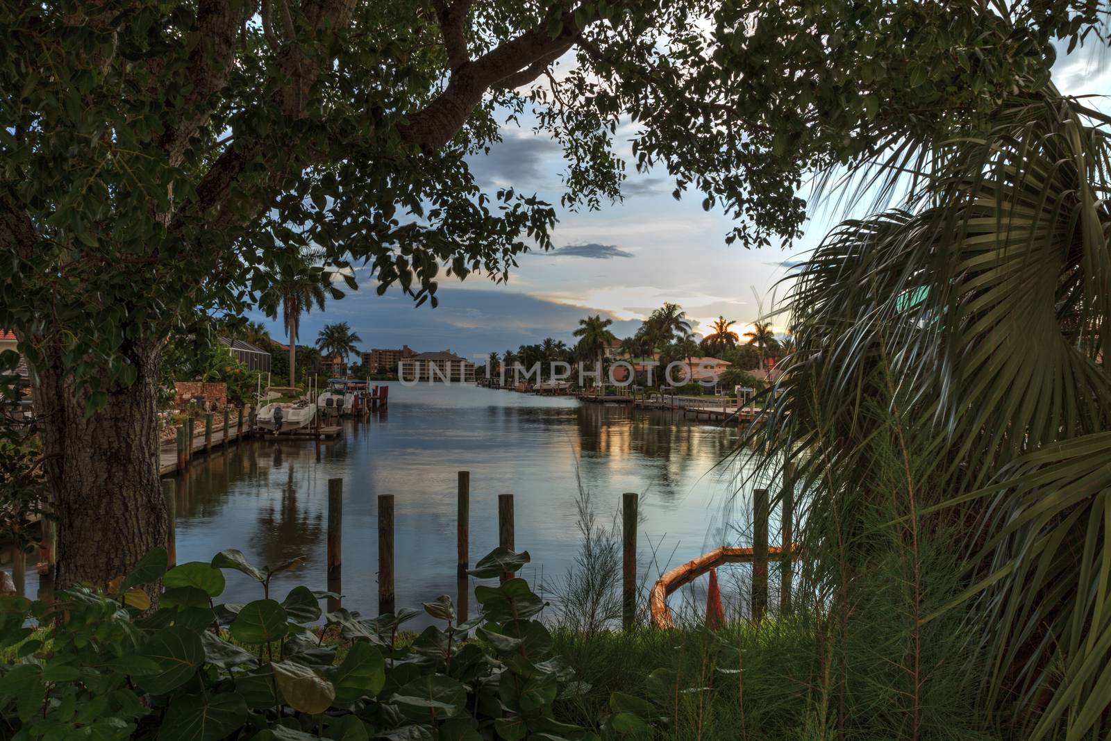 Sunrise over a Waterway leading to the Ocean near Vanderbilt Beach in Naples, Florida.