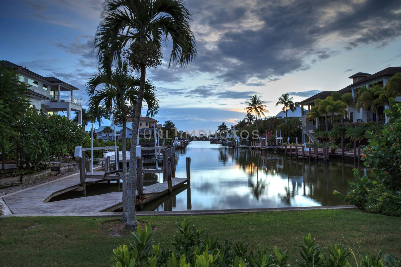 Sunset over a Waterway leading to the Ocean near Vanderbilt Beach in Naples, Florida.