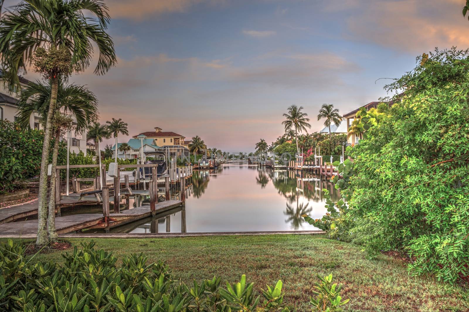 Sunrise over a Waterway leading to the Ocean near Vanderbilt Beach in Naples, Florida.