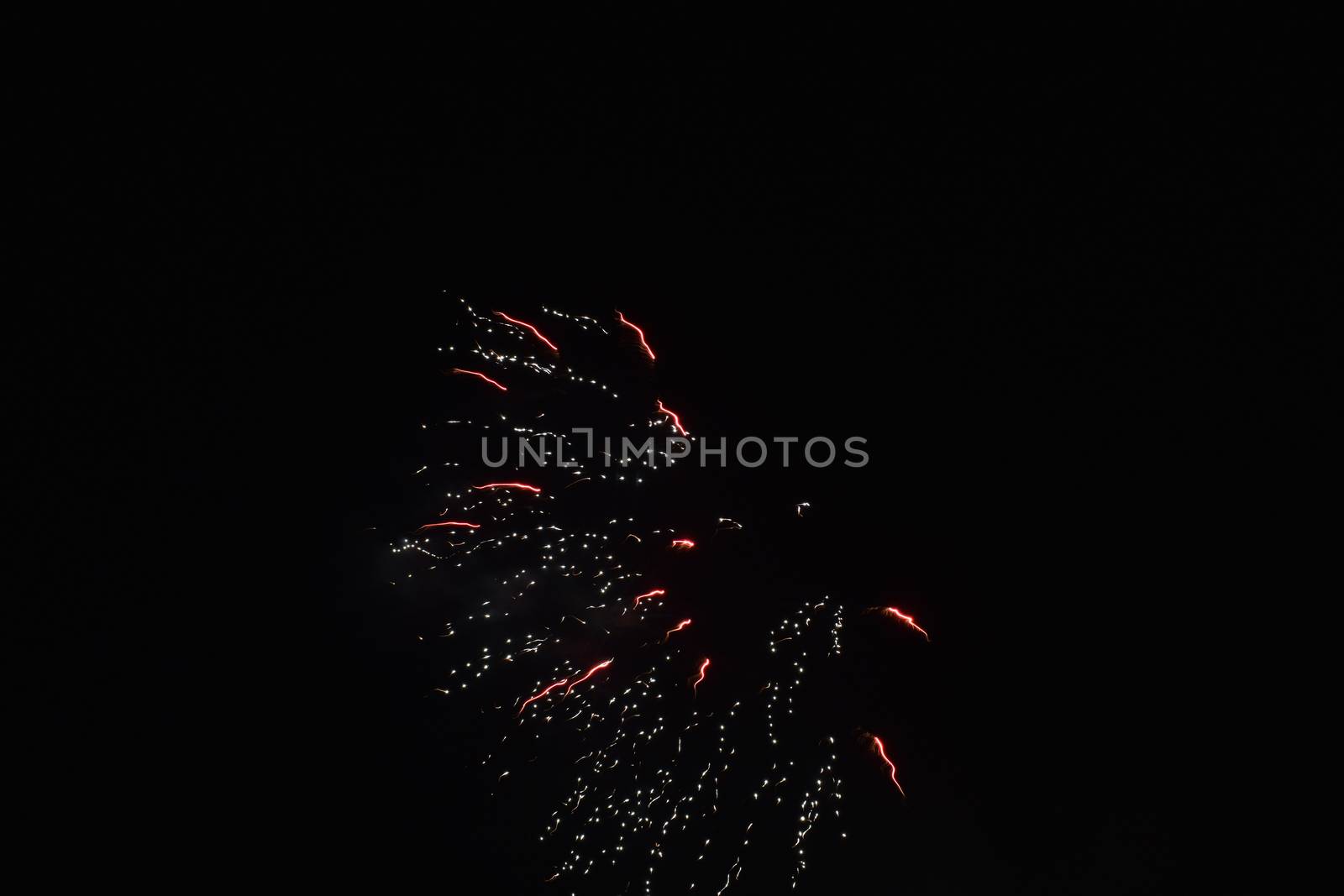 An Explosion of Bright Fireworks on a Pure Black Sky on the Fourth of July