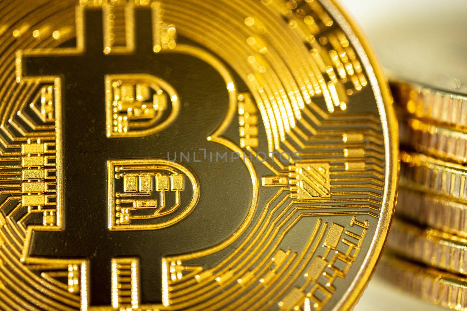 Bitcoin cryptocurrency - photo of golden bitcoin physical gold coin.