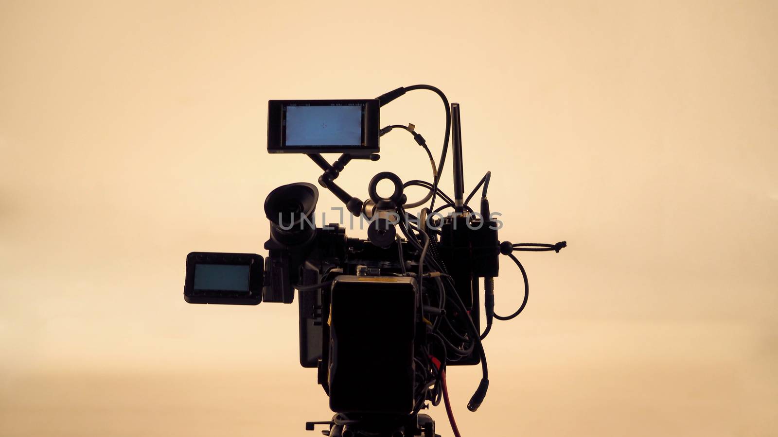 4K high defination video camera with tripod shooting in studio production and no people.