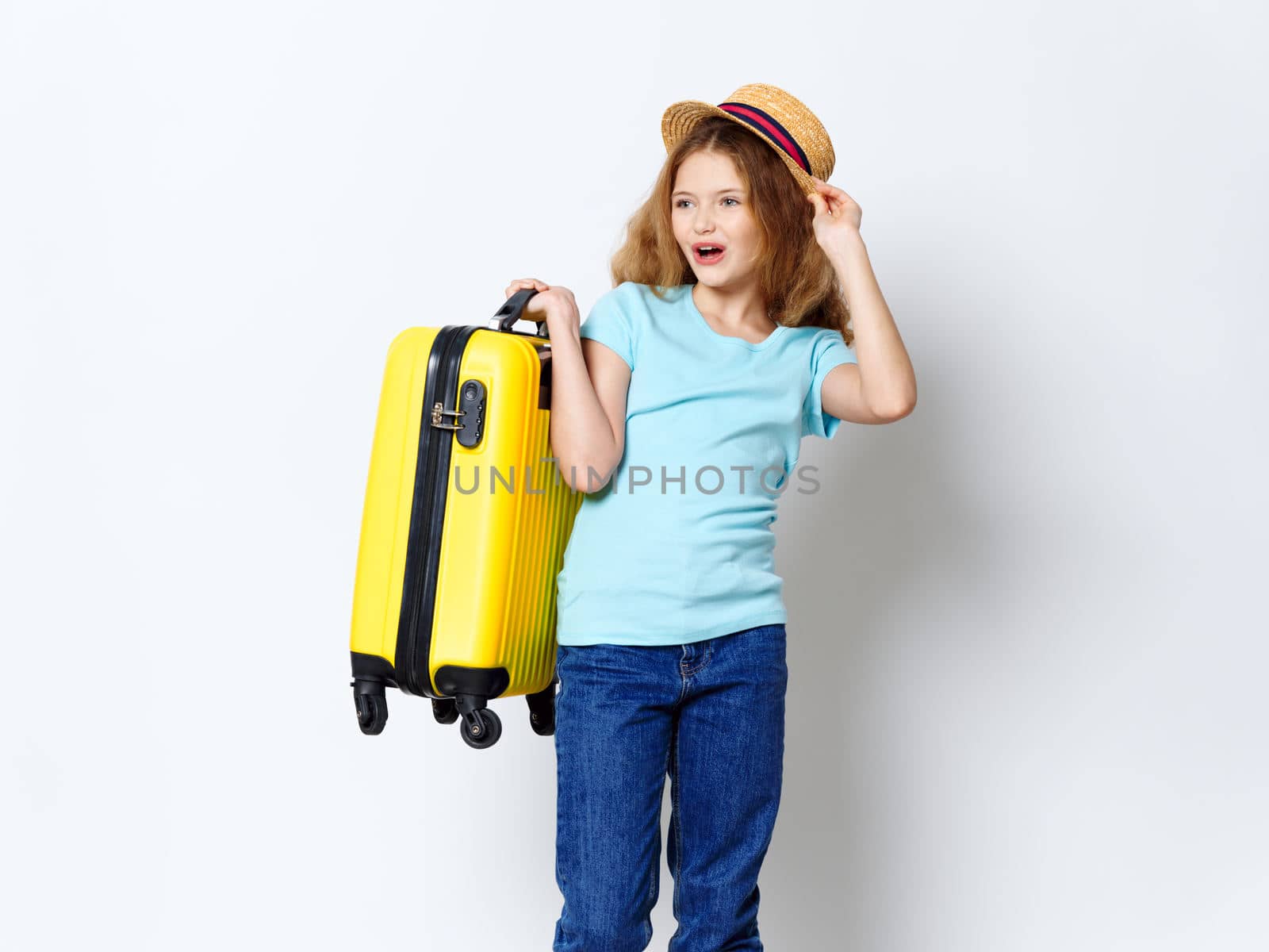 Girl holding yellow suitcase luggage vacation travel passenger studio