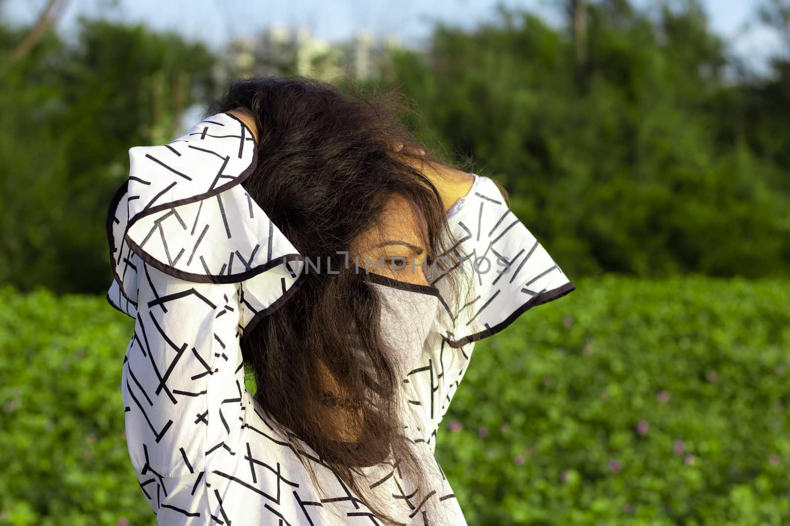 Indian woman wearing home made hygienic face medical mask to prevent infection, illness or flu .Protection against disease, coronavirus.