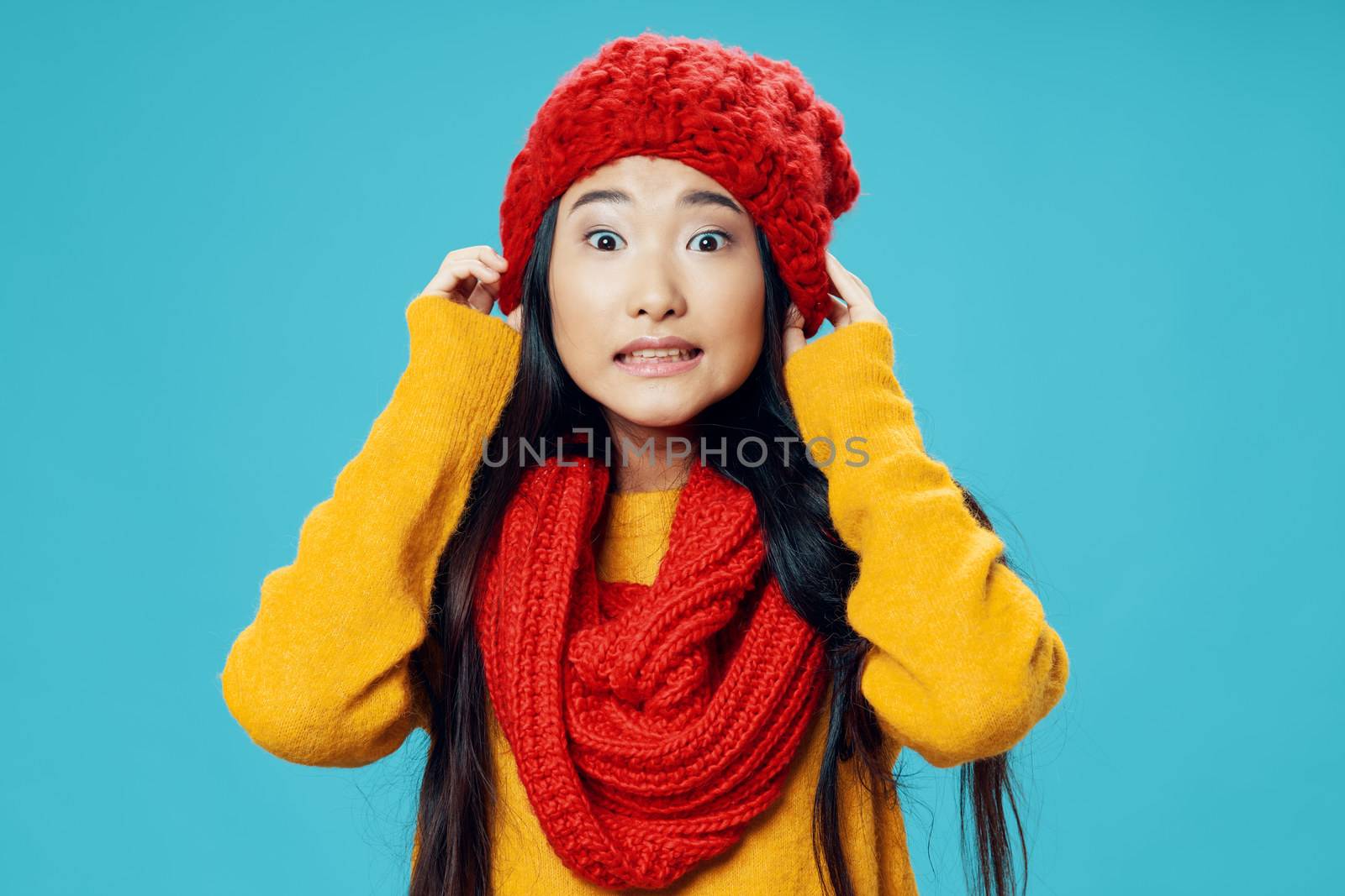 Woman with red scarf and hat emotions elegant style winter coolness charm lifestyle blue background